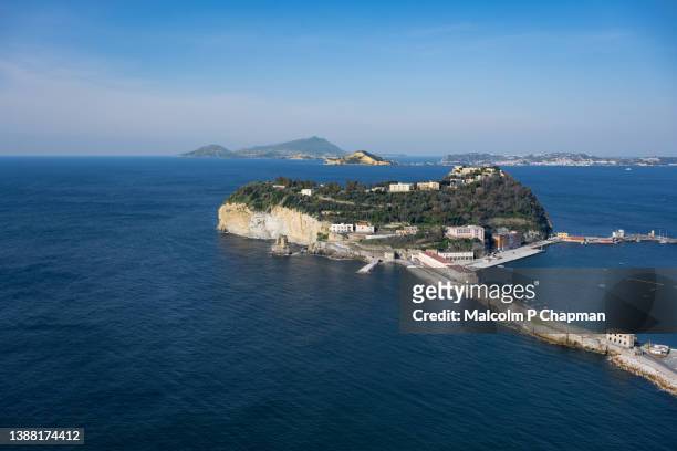 nisida island with view towards isola d'ischia, naples, italy - isola d'ischia stock pictures, royalty-free photos & images