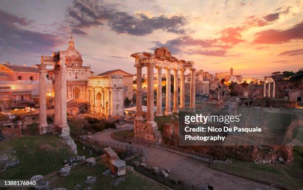 sunset over imperial fora, rome. - foro romano foto e immagini stock