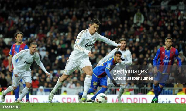 Cristiano Ronaldo of Real Madrid scores from the penalty spot during the la Liga match between Real Madrid and Levante at Estadio Santiago Bernabeu...