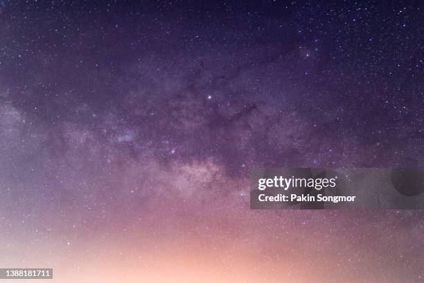 milky way galaxy has stars and space dust in the universe. - astrology symbols stock-fotos und bilder