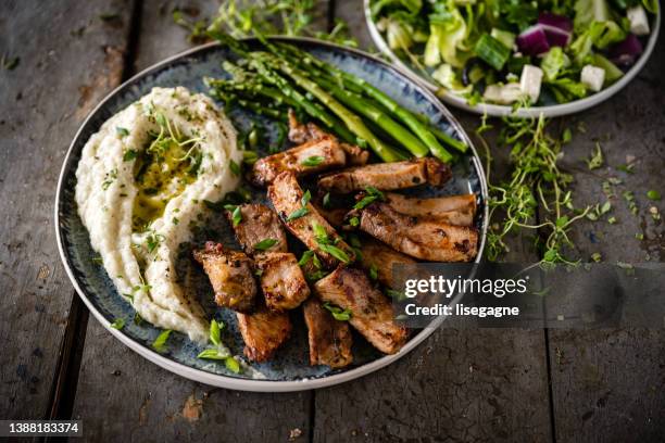 fried pork and mashed cauliflower - cauliflower bowl stock pictures, royalty-free photos & images