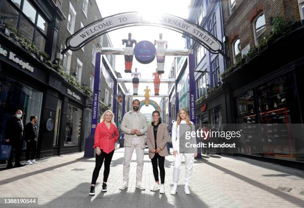 In this handout image Liv Cooke, Rio Ferdinand, Fara Williams and Elz the Witch unveil giant women’s table football players on London’s iconic...