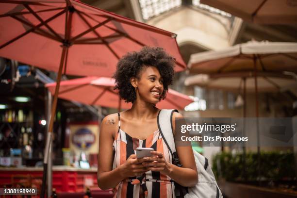 tourist using cell phone in the city - brazil bildbanksfoton och bilder