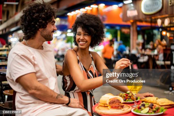 tourist couple at the market - brazil bildbanksfoton och bilder