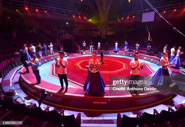 Woman and a dog look-on as performers including dancers from Ukraine rehearse the finale as Blackpool Tower Circus prepares to reopen following £1...