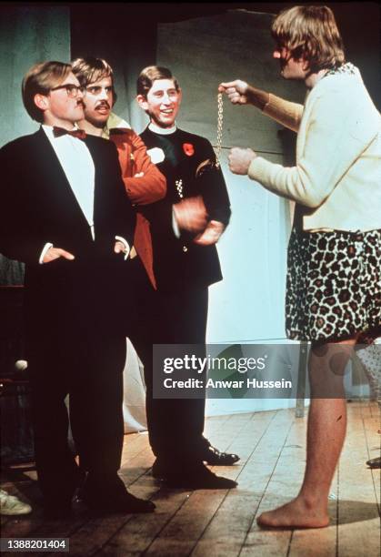 Prince Charles, Prince of Wales performs on stage in a Cambridge University Undergraduate Review in 1970 in Cambridge, England.