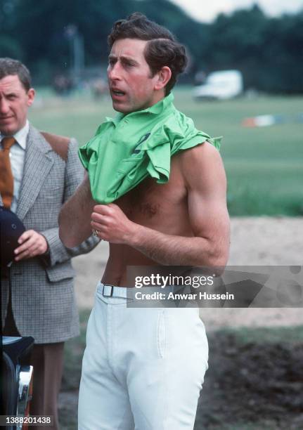 Prince Charles, Prince of Wales changes during a polo match on May 26, 1974 in Windsor, England.