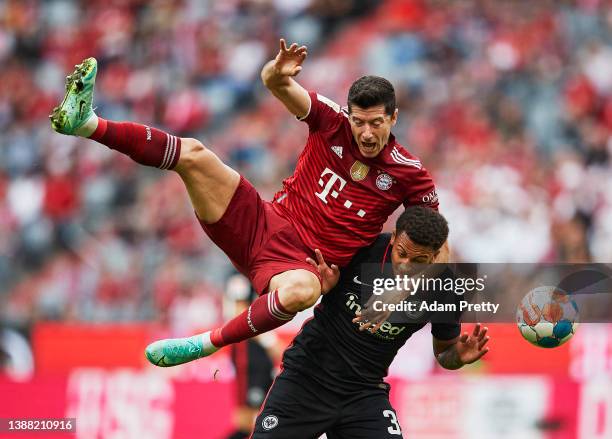 Robert Lewandowski of FC Bayern Muenchen battles for the ball with Tuta of Eintracht Frankfurt during the Bundesliga match between FC Bayern Munich...