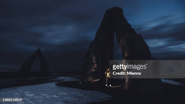 the arctic henge iceland young photographer at night in cold winter - arctic explorer stock pictures, royalty-free photos & images