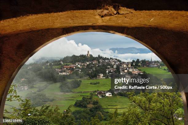 la valle,scenic view of trees and buildings against sky - raffaele corte stock pictures, royalty-free photos & images
