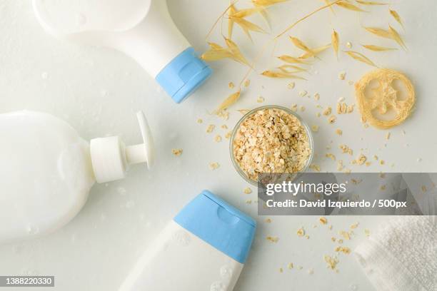 bath products with oat extract with straws on white table - oatmeal stock pictures, royalty-free photos & images