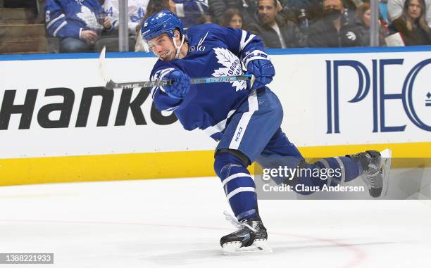 Mitchell Marner of the Toronto Maple Leafs blasts a shot against the Florida Panthers during an NHL game at Scotiabank Arena on March 27, 2022 in...