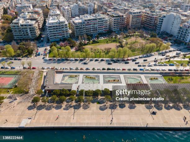 aerial view of the east part of thessalonikis beach with theme park gardens - thessalonika stock pictures, royalty-free photos & images