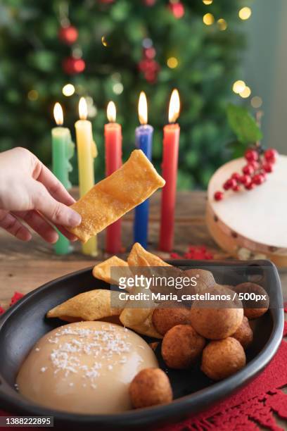 candlelight day typical food buuelo,natilla and hojuelas with - maria castellanos stock pictures, royalty-free photos & images
