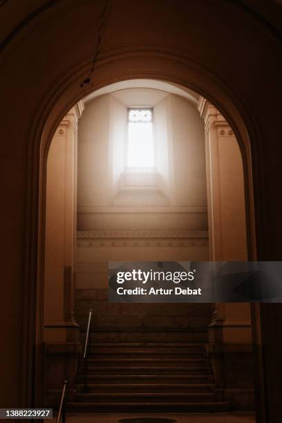 church with spiritual light through the window. - church interior stock pictures, royalty-free photos & images