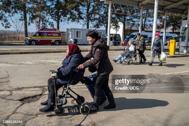 Ukranian refugees cross the border from Ukraine into Romania, at the border of Siret, in northern Romania, where they are welcomed by many different...