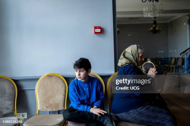 Cristian and Davide and their grandmother 'babushka' Maria at a temporary shelter near Siret in Romania. Davide and Cristian were born in Italy, near...