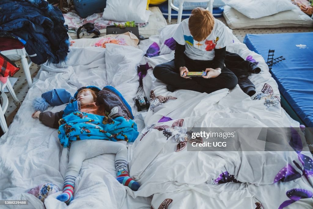 Ukranian refugees at a temporary shelter created inside the big ballroom and reception hall of the luxurious hotel Mandachi, in the Romanian town of Suceava, around 30 minutes from the border between Ukraine and Romania