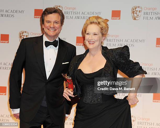 Presenter Colin Firth and Best Actress winner Meryl Streep pose in the press room at the Orange British Academy Film Awards 2012 at The Royal Opera...