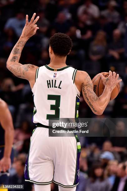 George Hill of the Milwaukee Bucks handles the ball during the game against the Memphis Grizzlies at FedExForum on March 26, 2022 in Memphis,...