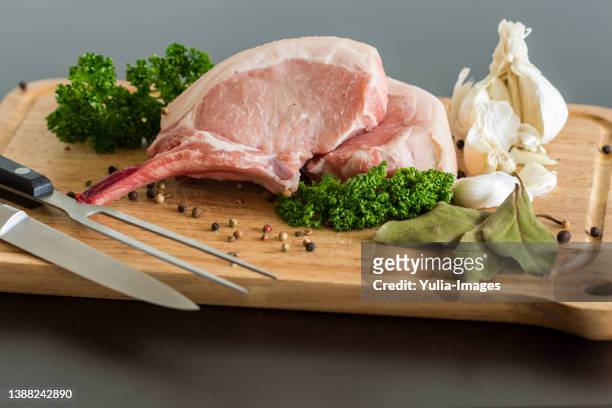 preparing pork cutlets for cooking - pork ストックフォトと画像