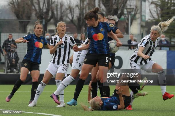 Lina Hurtig of Juventus clashes with Kathellen Souza Feitoza of Internazionale whilsLinda Sembrant of Juventus heads the ball against the back of...