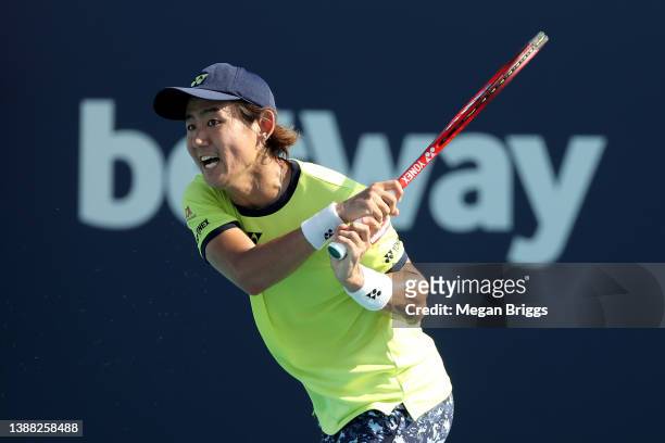 Yoshihito Nishioka of Japan returns a shot to Lloyd Harris of South Africa during the Men's Singles match on Day 8 of the 2022 Miami Open presented...
