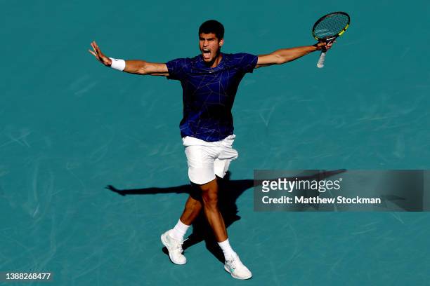 Carlos Alcaraz of Spain celebrates match point against Marin Cilic of Croatia during the Miami Open at Hard Rock Stadium on March 28, 2022 in Miami...