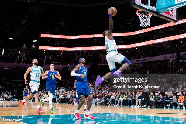 Terry Rozier of the Charlotte Hornets drives to the basket against the Denver Nuggets in the first quarter at Spectrum Center on March 28, 2022 in...