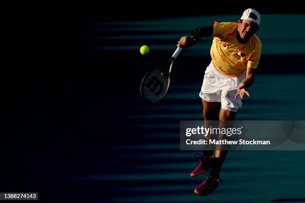 Tommy Paul serves toTaylor Fritz during the Miami Open at Hard Rock Stadium on March 28, 2022 in Miami Gardens, Florida.