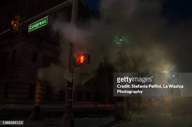 detroit congress street at night with steam - spooky road stock pictures, royalty-free photos & images