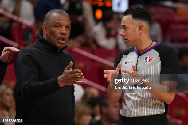 Head coach Alvin Gentry of the Sacramento Kings talks with referee Ray Acosta during the first half against the Miami Heat at FTX Arena on March 28,...