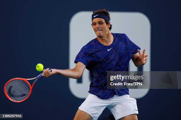 Taylor Fritz of the United States hits a forehand against Tommy Paul of the United States in the third round of the Miami Open at the Hard Rock...