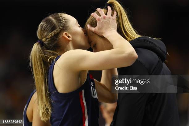 Paige Bueckers of the UConn Huskies kisses Dorka Juhasz of the UConn Huskies on the forehead in the game against the NC State Wolfpack in the NCAA...