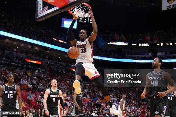 Bam Adebayo of the Miami Heat dunks the basketball during the second half against the Sacramento Kings at FTX Arena on March 28, 2022 in Miami,...