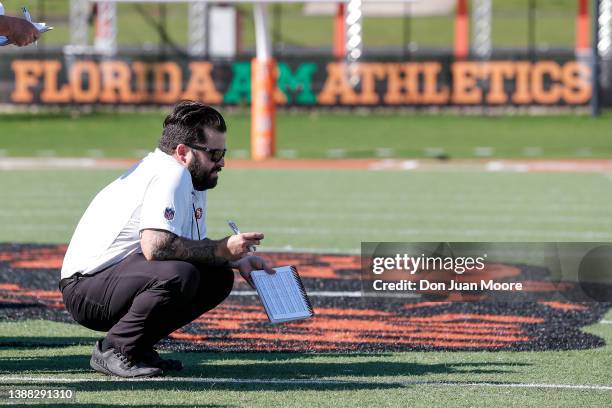 Scout from the San Francisco 49ers observe players during Florida A&M Pro Day at Bragg Memorial Stadium on the campus of Florida A&M University on...