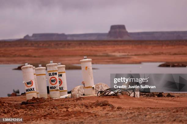 Buoys sit on the beach near the Wahweap Marina at Lake Powell on March 28, 2022 in Page, Arizona. As severe drought grips parts of the Western United...