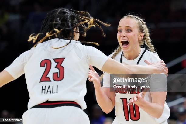 Hailey Van Lith of the Louisville Cardinals celebrates with Chelsie Hall after the 62-50 win over the Michigan Wolverines in the Elite Eight round...