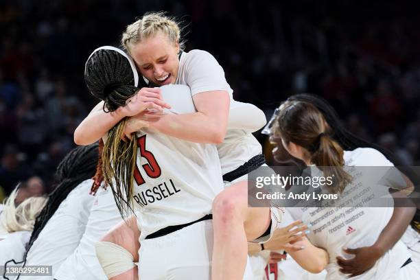 Hailey Van Lith of the Louisville Cardinals celebrates with Merissah Russell after the 62-50 win over the Michigan Wolverines in the Elite Eight...