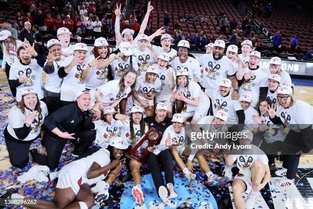 The Louisville Cardinals celebrate with the Regional Championship trophy after the 62-50 win over the Michigan Wolverines in the Elite Eight round...