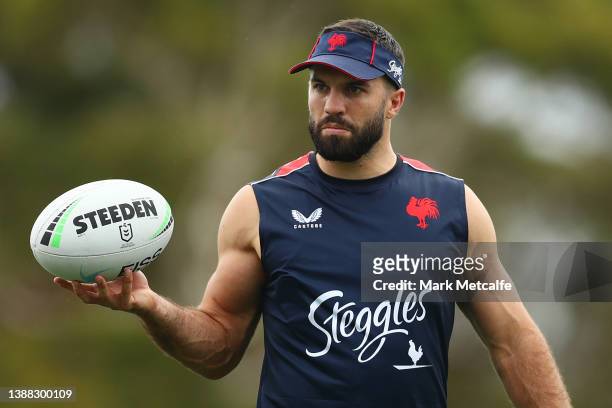 James Tedesco spins a ball during a Sydney Roosters NRL training session at Kippax Lake on March 29, 2022 in Sydney, Australia.