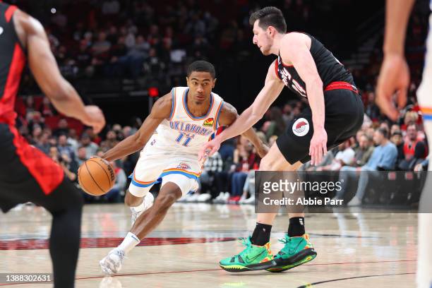 Theo Maledon of the Oklahoma City Thunder works towards the basket against Drew Eubanks of the Portland Trail Blazers during the fourth quarter at...