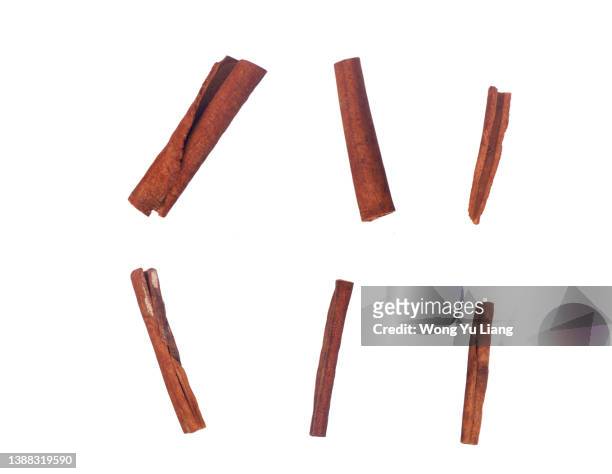 top view of cinnamon sticks isolated on white - canelo fotografías e imágenes de stock