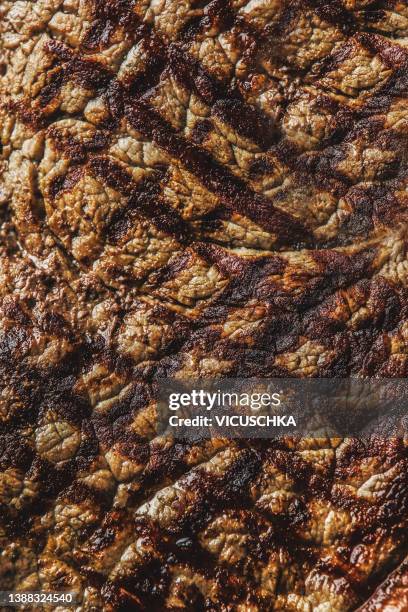 texture background of grilled meat. - steek stock pictures, royalty-free photos & images