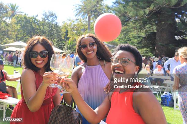 Visitors and locals enjoy the outdoors Constantia Fresh wine festival held annually at Buitenverwachting Winery on February 20, 2022 in Cape Town,...