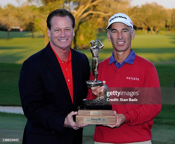 Tom Burns, Chief Distribution Officer for Allianz and Covey Pavin, pose with the winner's trophy after the final round of the Allianz Championship at...