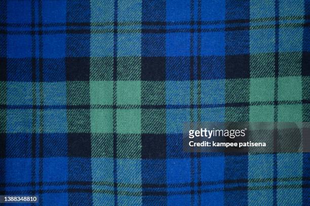 cotton sleepwear fabric background. - blue checked pattern stock pictures, royalty-free photos & images