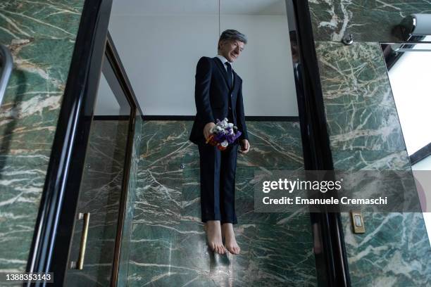 General view of ‘YOU’, a self-portrait sculpture of the Italian artist Maurizio Cattelan hanging from a noose, is pictured at Casa...