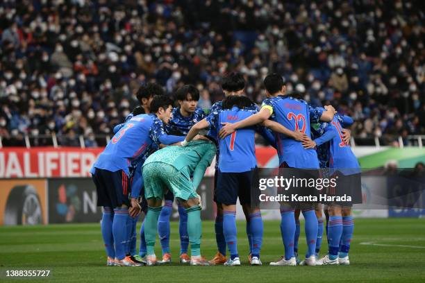 Japanese players huddle prior to the FIFA World Cup Asian Qualifier Final Round Group B match between Japan and Vietnam at Saitama Stadium on March...