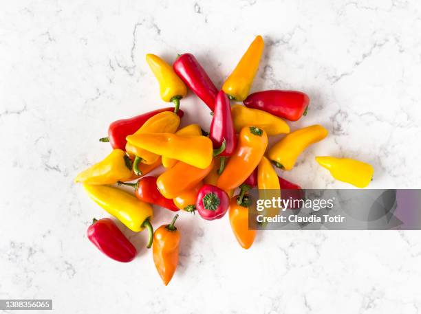 sweet mini bell peppers on white background - bell pepper stockfoto's en -beelden